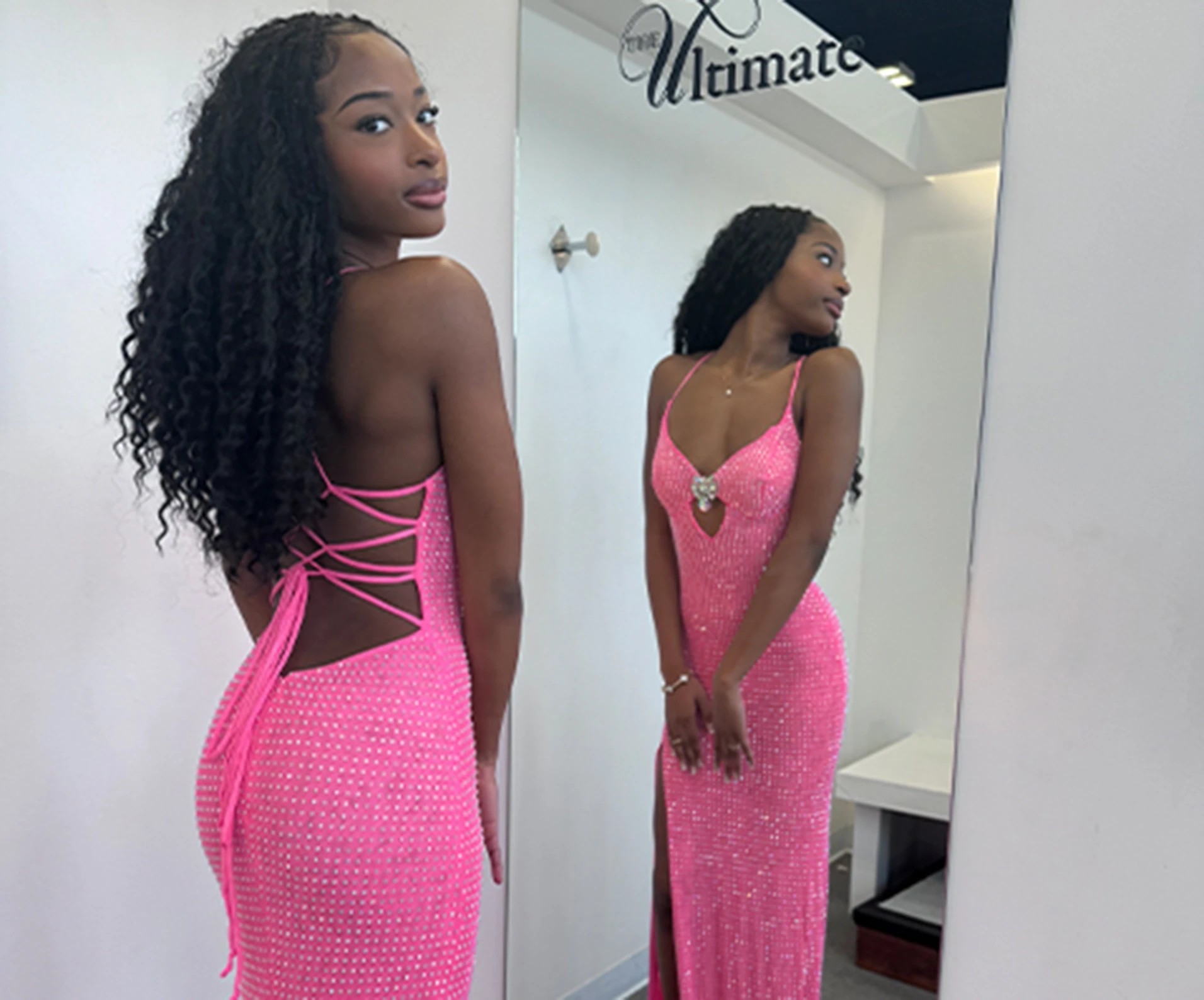 Model wearing a pink formal dress
